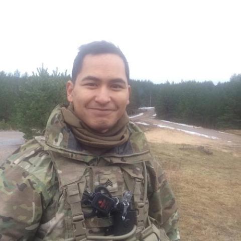 Corey Crisostomo in army medic uniform