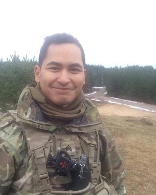 Corey Crisostomo in army medic uniform